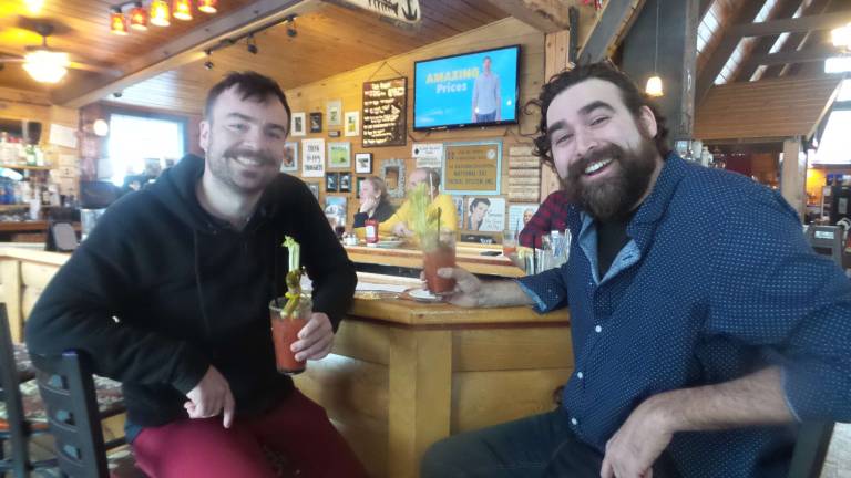 Michael Jefferson (left) is &#x201c;Mr. November,&#x201d; and Travis Rivera of Black &amp; Brass (right) is &#x201c;Mr. August.&#x201d; (Photo by Frances Ruth Harris)