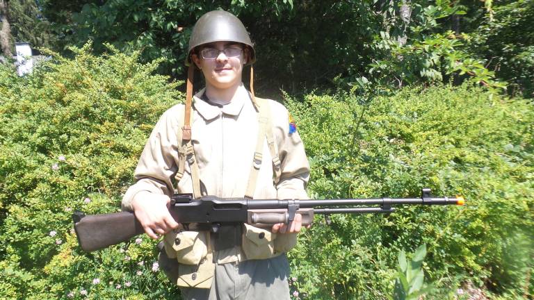 Mark DeBlock is also the camera man. Here he carries a Browning Automatic Rifle. (Photo by Frances Ruth Harris)