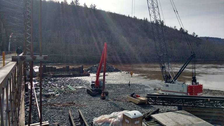 The area that was flooded the previous two days due to the storm is already draining as construction is restarting. (Photo by Anya Tikka)