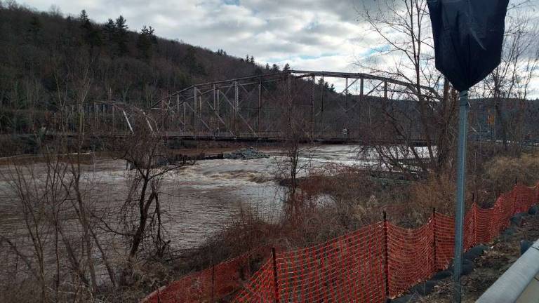 The area that was flooded the previous two days due to the storm is already draining as construction is restarting. (Photo by Anya Tikka)