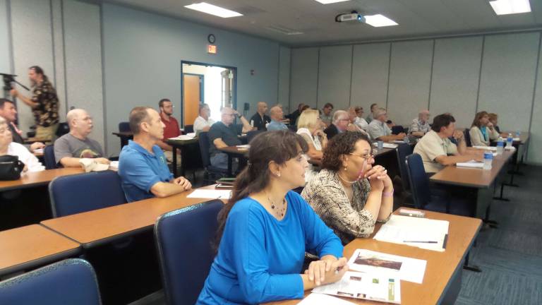 Residents listen attentively to the plan for next year's gypsy moth suppression program (Photo by Frances Ruth Harris)