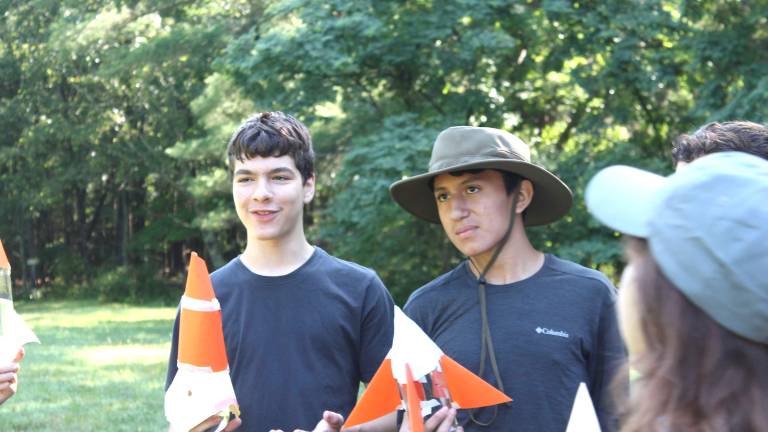 PEEC counselors lead a STEM activity with campers.