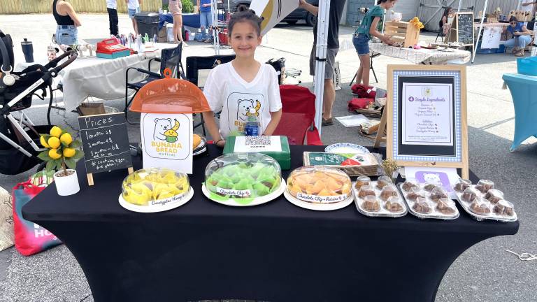 A young entrepreneur at the 2025 fair.