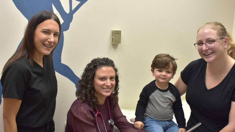 Amy Cellar and Dr. Veronica Cellini with 2-year-old Russell Veleze, and his mom, Charity-Beth Veleze, of Lake Ariel.