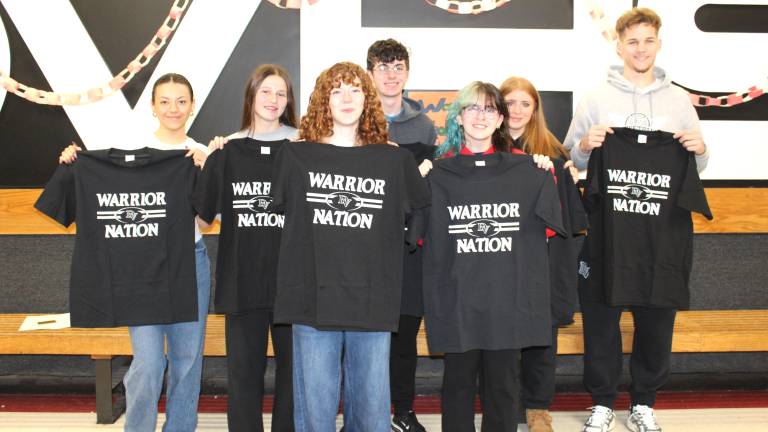 Delaware Valley High School Students of the Month pose with Warrior Nation shirts.