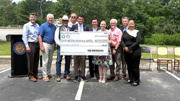 Rep. Bresnahan presents a check for $2 million in federal funding for State Route 6 repairs.