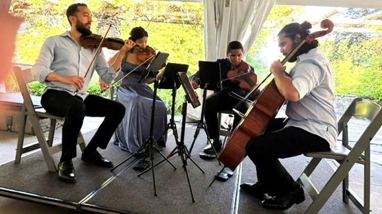 Ivalas Quartet perfoms at the Grey Towers pool pavilion. ( Photo by Marilyn Rosenthal)