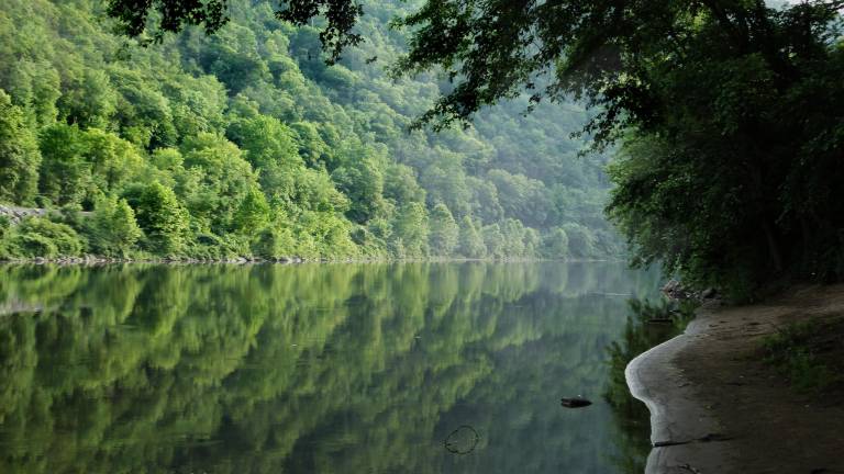 The body of a 58-year-old woman was recovered early Sunday afternoon from the Delaware River between Westfall, Pa. and Port Jervis, N.Y.