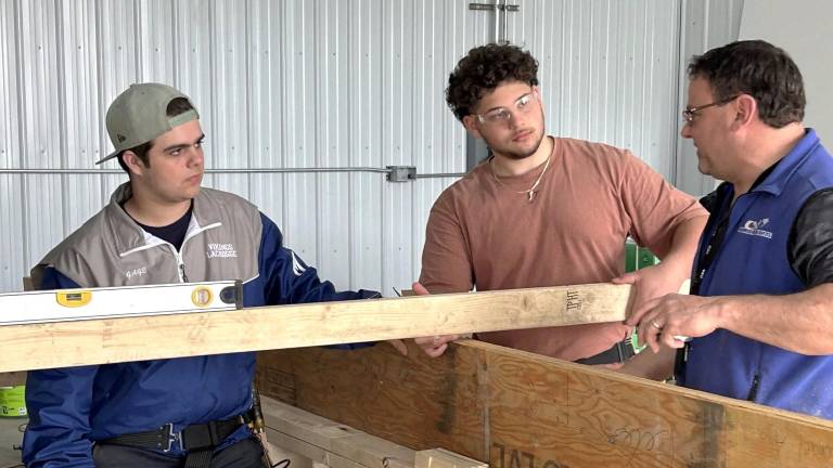 Students at Orange-Ulster BOCES in Goshen work on the modular units for the village for veterans with Corey Moore, Director of Construction Education. Photo provided.