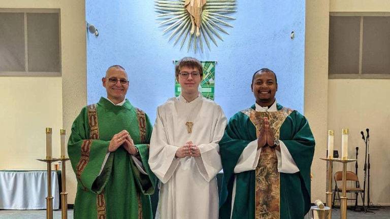 Left to right Fr. Benesch, Deacon John, and Gabriel Wagner Alter server. (Photo from Files of St. Vincent de Paul)