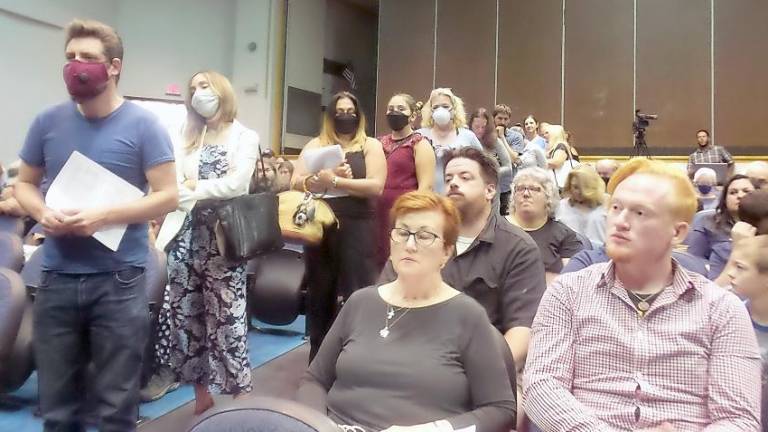 People lined up as they waited to speak about mask mandates before the Delaware Valley school board at a recent meeting (Photo by Frances Ruth Harris)